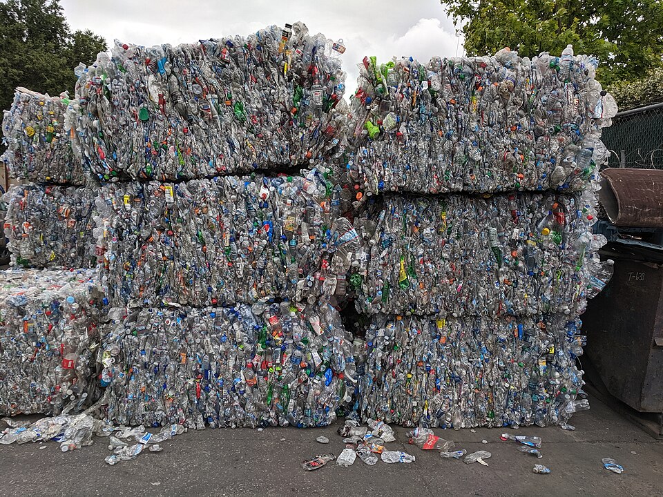 Stacked bales of compressed PET plastic bottles