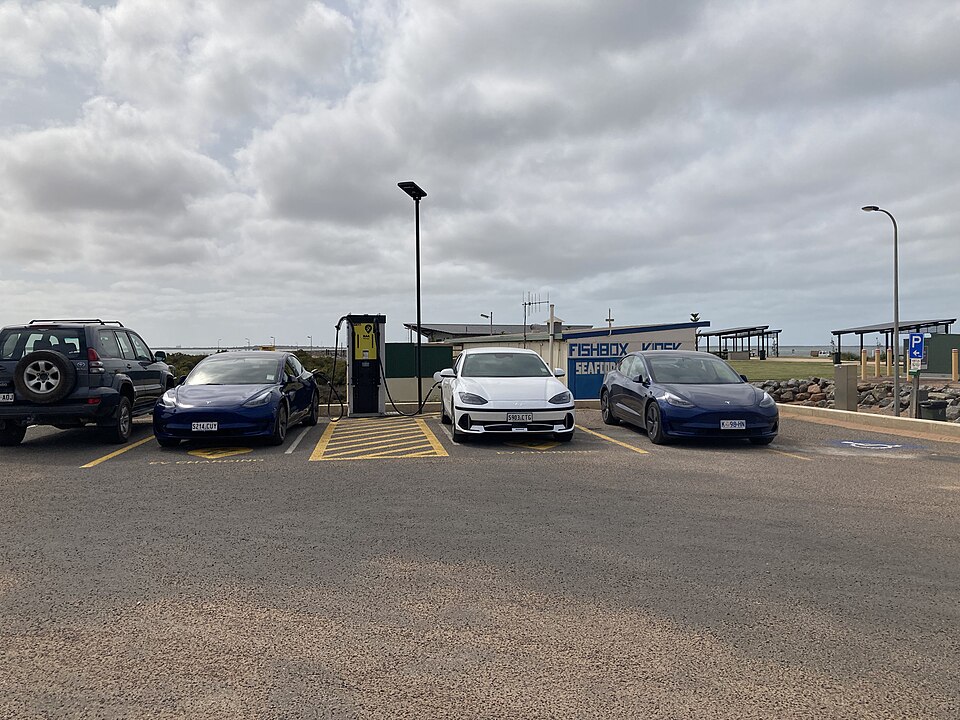 Electric cars charging at a regional charging hub