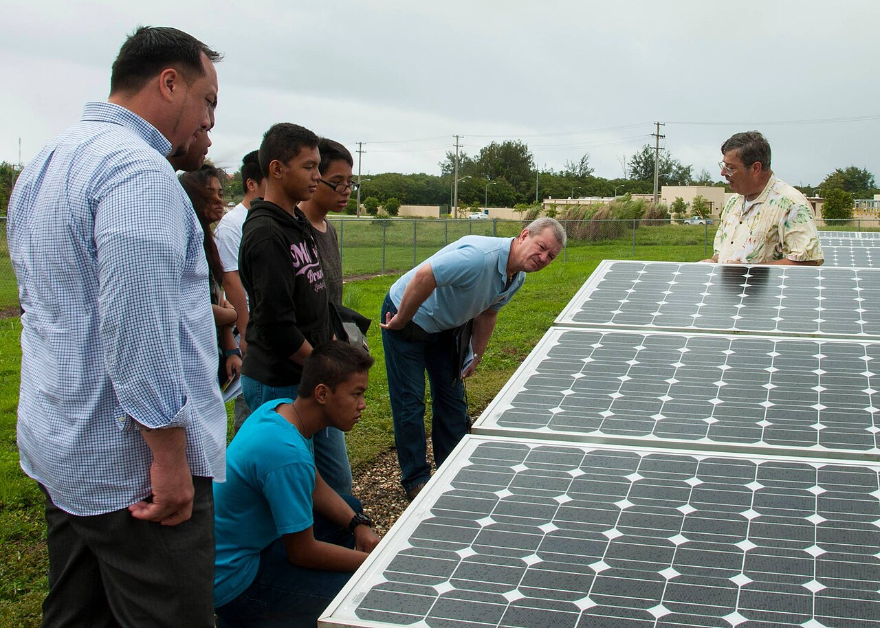 GreenPulse Club members touring a solar panel installation